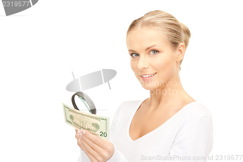 Image of woman with magnifying glass and money