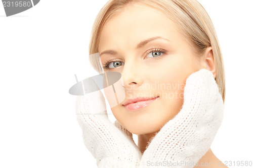 Image of beautiful woman in white mittens