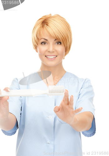 Image of doctor with toothbrush