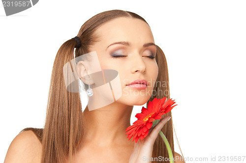 Image of lovely woman with red flower