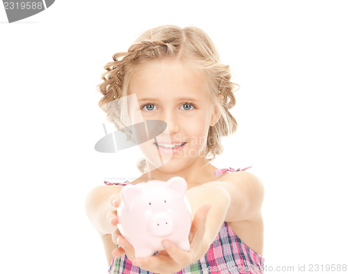 Image of little girl with piggy bank