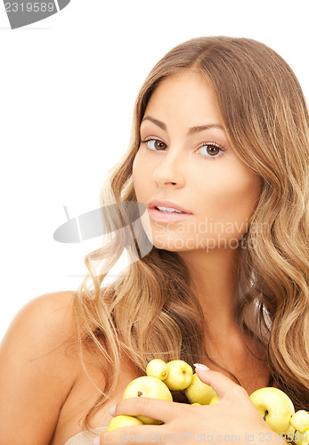 Image of lovely woman with green apples