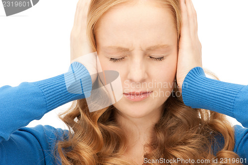 Image of woman with hands on ears