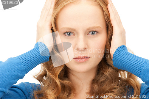 Image of woman with hands on ears