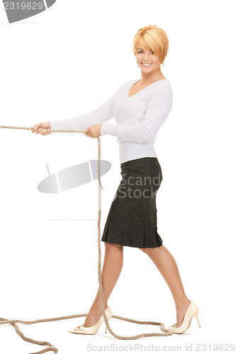 Image of business woman pulling rope