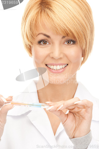 Image of attractive female doctor with thermometer