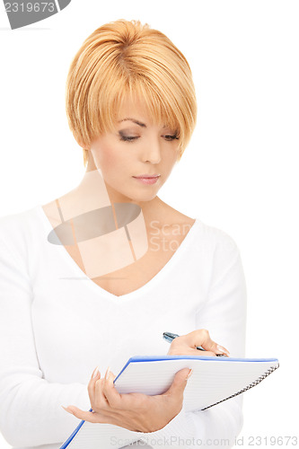 Image of attractive businesswoman with notebook