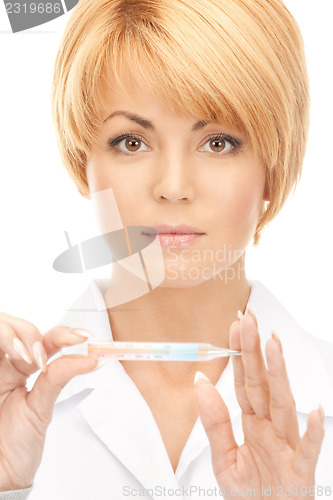 Image of attractive female doctor with thermometer