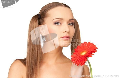 Image of lovely woman with red flower