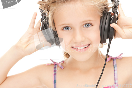 Image of happy girl in big headphones