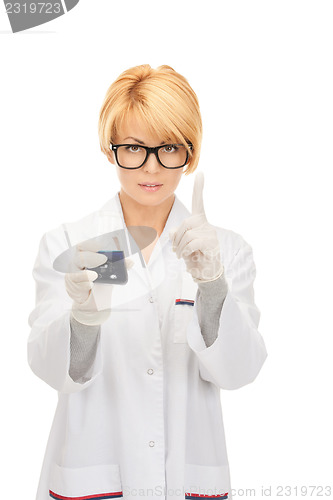 Image of lab worker holding up test tube