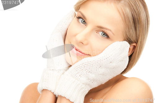 Image of beautiful woman in white mittens