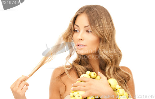 Image of lovely woman with green apples