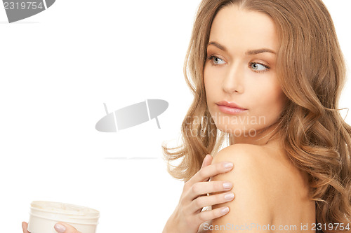 Image of beautiful woman with moisturizing creme