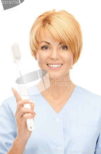 Image of doctor with toothbrush