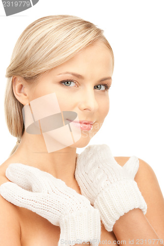 Image of beautiful woman in white mittens