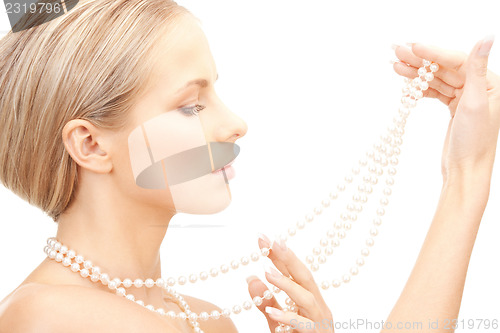 Image of beautiful woman with pearl beads