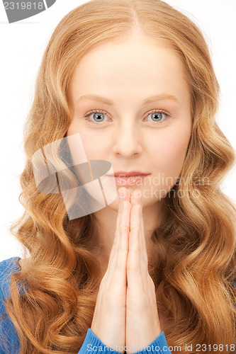 Image of praying businesswoman