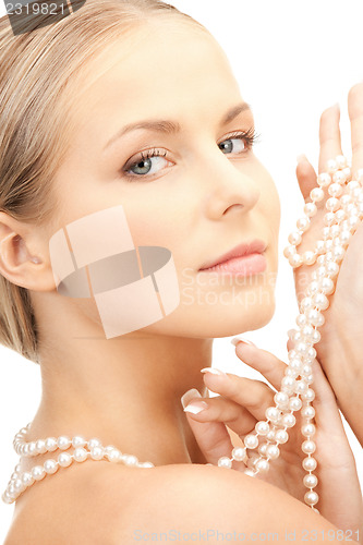 Image of beautiful woman with pearl beads