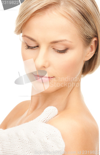Image of beautiful woman in white mittens