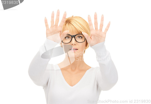 Image of businesswoman working with something imaginary 