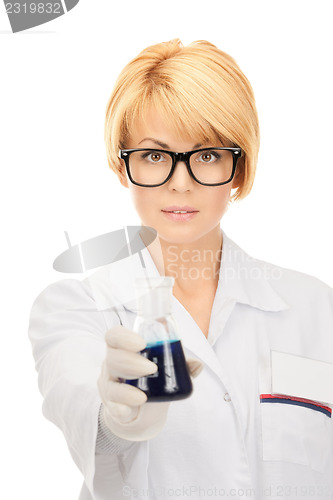 Image of lab worker holding up test tube