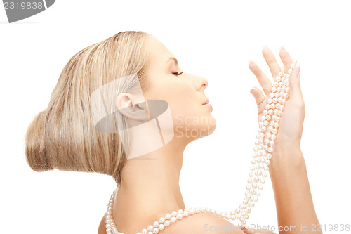 Image of beautiful woman with pearl beads
