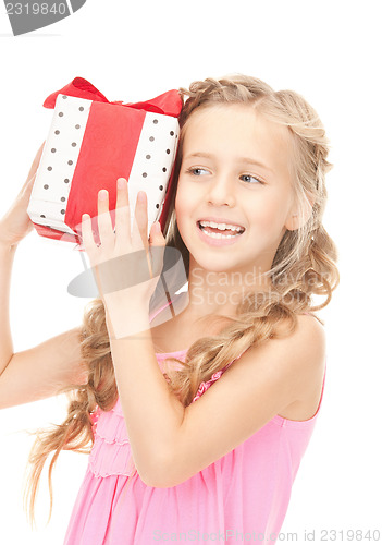 Image of happy little girl with gift box