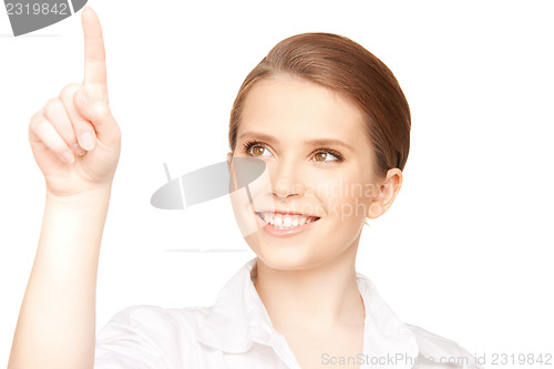 Image of businesswoman working with something imaginary