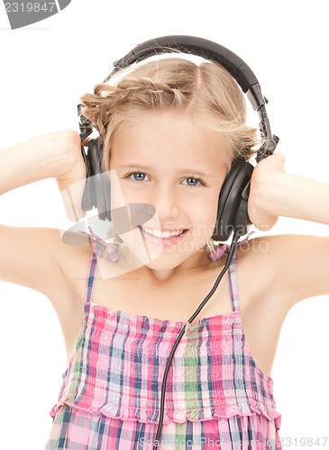Image of happy girl in big headphones