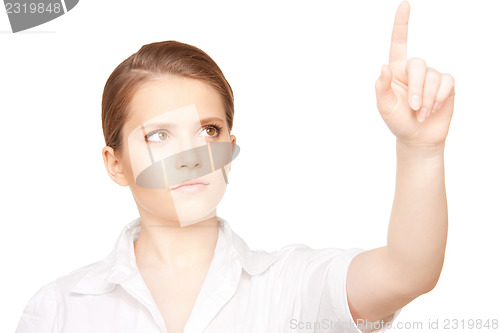 Image of businesswoman working with something imaginary