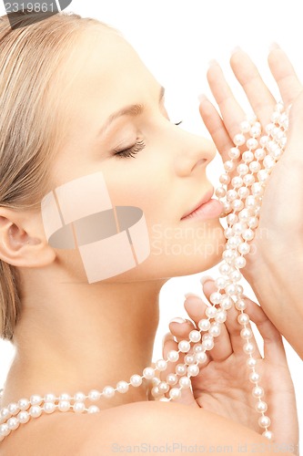 Image of beautiful woman with pearl beads