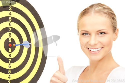 Image of businesswoman with dart and target