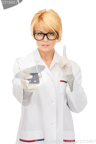 Image of lab worker holding up test tube