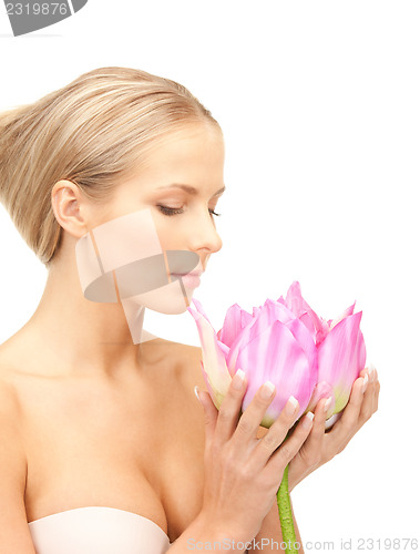 Image of beautiful woman with lotus flower