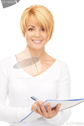 Image of attractive businesswoman with notebook