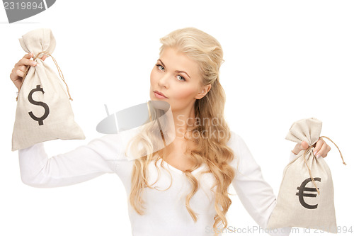 Image of woman with euro and dollar bags