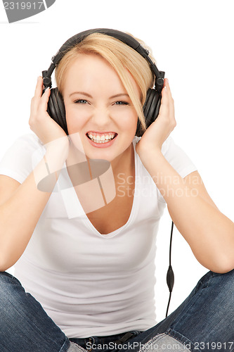 Image of  happy teenage girl in big headphones