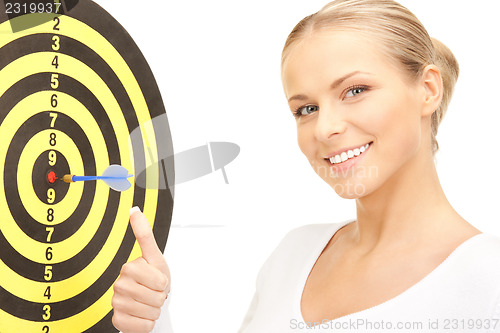 Image of businesswoman with dart and target