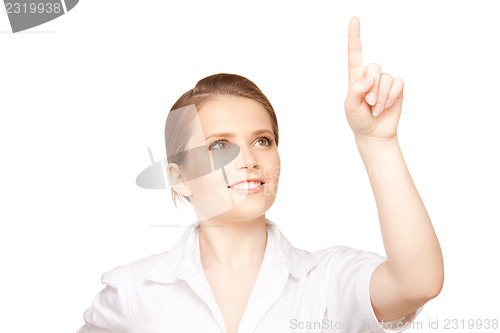 Image of businesswoman working with something imaginary