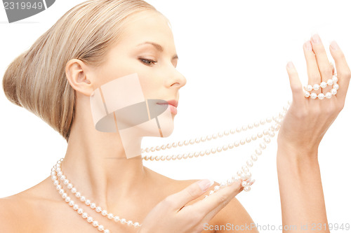 Image of beautiful woman with pearl beads