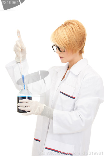 Image of lab worker holding up test tube