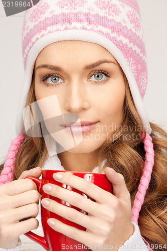 Image of beautiful woman with red mug