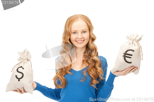 Image of woman with euro and dollar bags