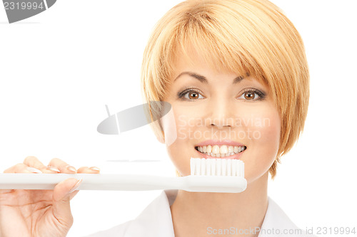 Image of doctor with toothbrush