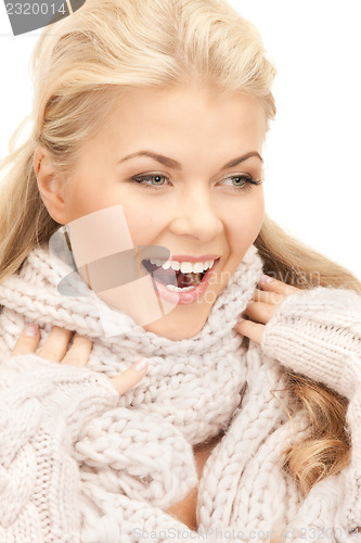 Image of beautiful woman in mittens  