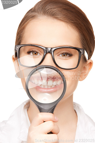 Image of woman with magnifying glass showing teeth