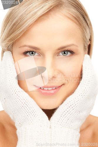 Image of beautiful woman in white mittens 