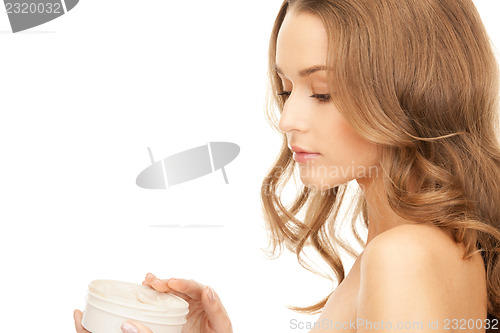 Image of beautiful woman with moisturizing creme