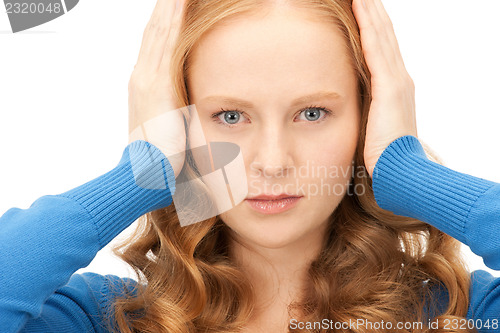 Image of woman with hands on ears